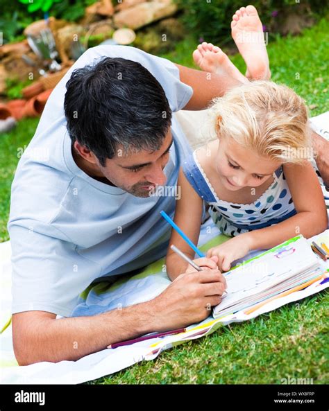 father and daughter painting together